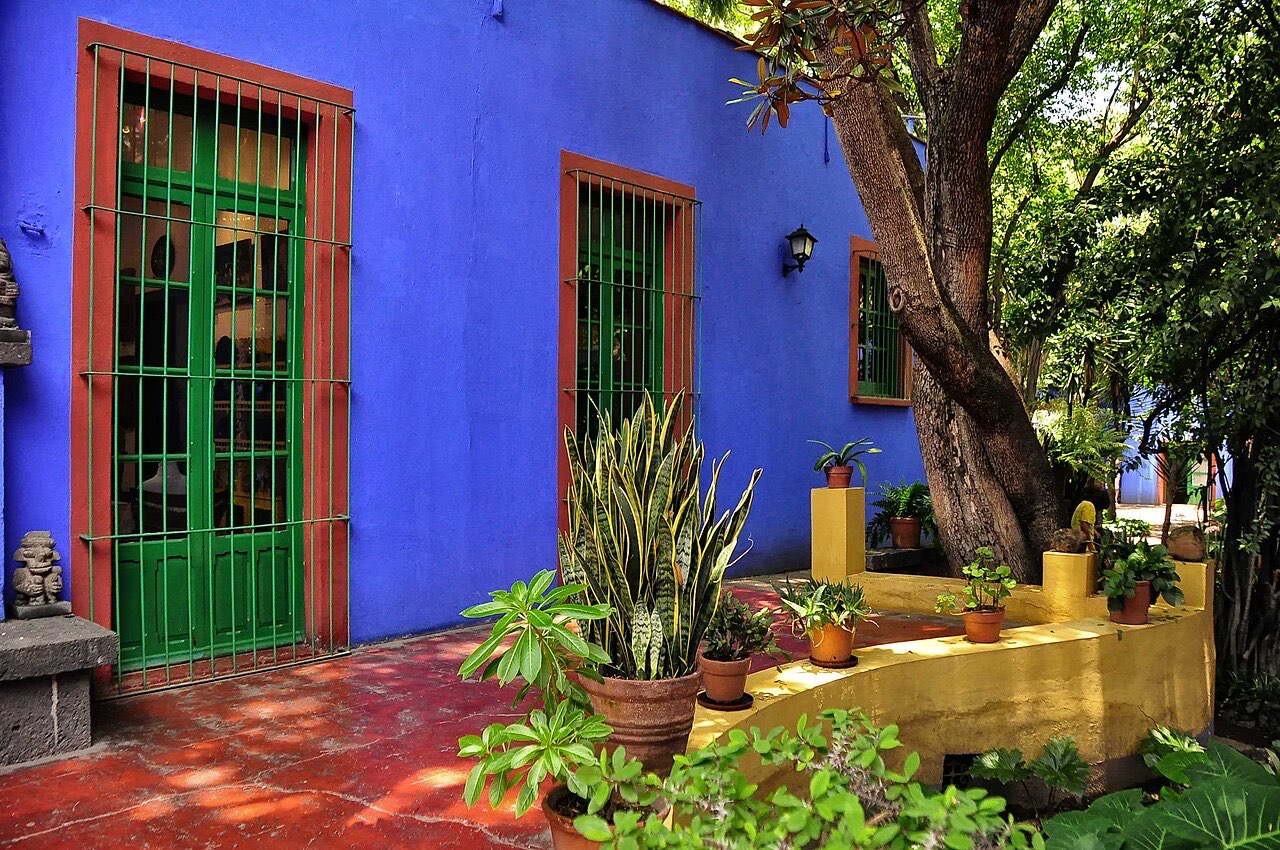 Cobalt-blue walls and green shutters in Frida Kahlo's courtyard